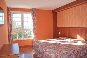Cama o camas de una habitación en Hotel Reino Nevado