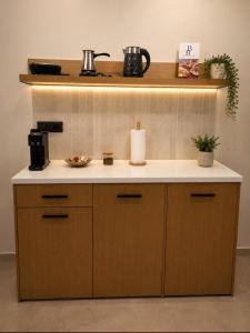 a kitchen with a sink and a counter top at Estia Luxury Suites & Spa in Platamonas +32 photos