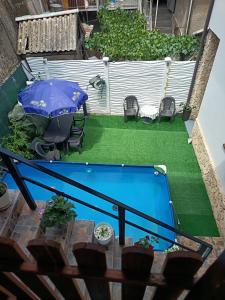 an overhead view of a patio with a table and an umbrella at Casa Cristyana in Orşova