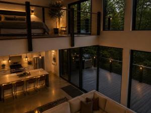 an aerial view of a house with a living room at Fall Hideaway - VailsBluff - Romantic Escape in Broken Bow