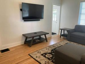 a living room with a couch and a table at East Nashville Discovery in Nashville