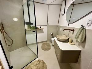 a bathroom with a shower and a sink at Ostoja Szumilas in Kąsna Górna +75 photos