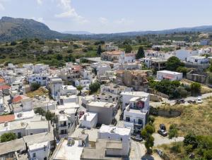 an aerial view of a city with white buildings at Elia village in Kalithies