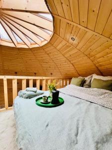 a room with a bed with a tray on it at Ostoja Szumilas in Kąsna Górna