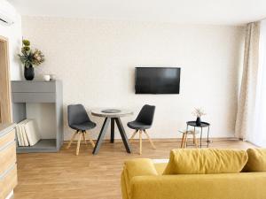 a living room with a couch and a table at Apartmán Mia in Mikulov
