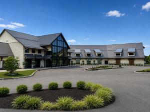 a large building with a parking lot in front of it at Hershey Farm Resort in Ronks