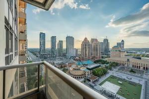 a view of a city from the balcony of a building at Designer Apartment in Prime Location in Mississauga