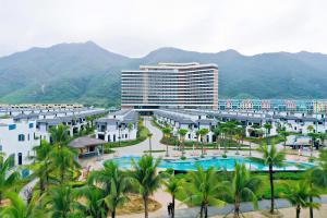 an aerial view of a resort with mountains in the background at Sonasea Van Don Letavia Hotel in Thâm Câu