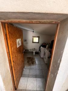 an entrance to a bathroom with a toilet in a room at Camp pey in Saubion