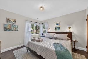 a bedroom with a large bed and a window at Glenside Getaway in Muskegon