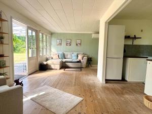 a living room with a couch and a table at M27-Vaeggerlose-Tornbladvej-14 in Bøtø By