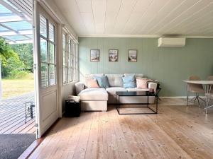 a living room with a couch and a table at M27-Vaeggerlose-Tornbladvej-14 in Bøtø By