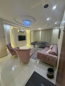 a living room with a couch and a table at Lovely High Quality Self Check-in Apartments شقق سلام بالدخول الذاتي in Medina