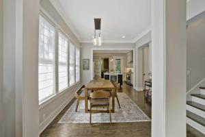 a dining room with a table and chairs at Musician's Ranch in Franklin