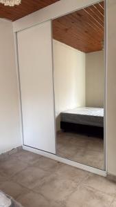 a bedroom with sliding glass doors with a bed in it at Aurora - calle Del Sol in Santa Rosa