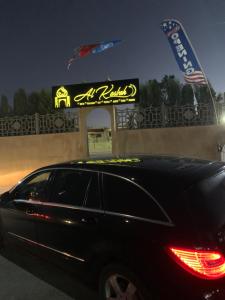 a car parked in front of a restaurant at night at Al Kasbah Resort in El Jadida