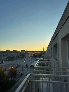 a balcony of a building with a view of a street at MAX Apartaments in Częstochowa