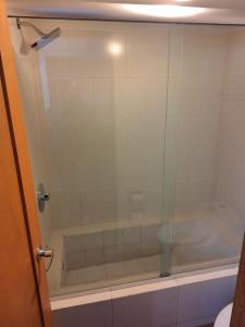 a shower with a glass door in a bathroom at Depa en planta baja con alberca in Puerto Vallarta