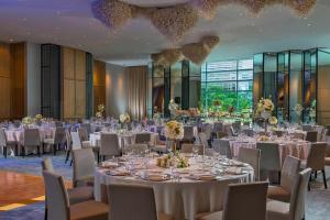 a banquet hall with white tables and chairs and chandeliers at The St. Regis Mexico City in Mexico City +137 photos