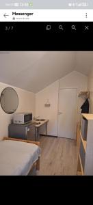 a room with a bed and a desk and a table at Korter in Tartu