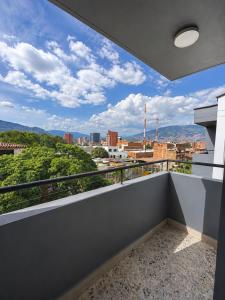 a balcony with a view of the city at Hotel Ofix - Laureles in Medellín