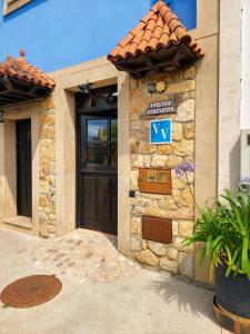 a door to a building with a sign on it at La Mío Quintana in Corao