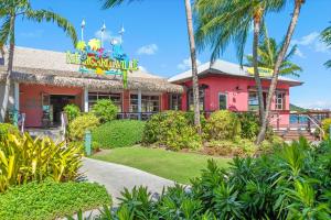 a restaurant with a red building with a neon sign at Margaritaville Vacation Club - St Thomas in Frydendal