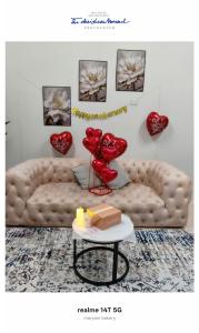 a living room with a couch and red balloons at Rumah Tamu Maryam in Temerloh