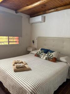 a bedroom with a bed with a towel on it at Hotel Cristobal de Colón in Colón +95 photos