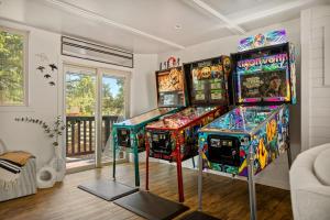 a room with four arcade games on display at Larks Nest in Big Bear Lake in Big Bear Lake