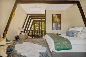 a bedroom with a bed and a balcony at Larks Nest in Big Bear Lake in Big Bear Lake +44 photos