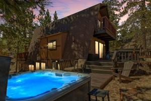 a large hot tub in front of a house at Larks Nest in Big Bear Lake in Big Bear Lake