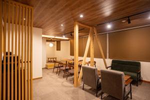 a conference room with a table and chairs at メイプルハイム in Iiyama