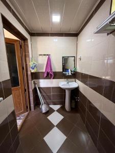 a bathroom with a sink and a mirror at Relax in mountains in İsmayıllı +4 photos