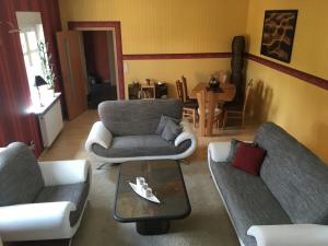 a living room with two couches and a coffee table at La Vita in Ludwigslust