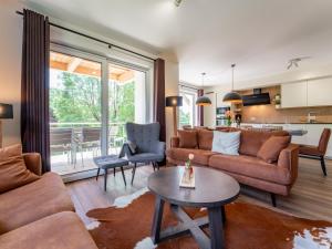 a living room with a couch and a table at Werfenblick in Werfenweng