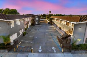 an aerial view of a parking lot at a apartment complex at Encore Inn Inglewood in Inglewood