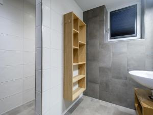a bathroom with a sink and a toilet and a window at Hirnreit in Leogang +18 photos