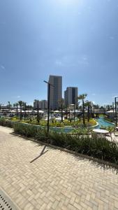a park with a street light and a sidewalk at BEACH RESORT Em SALINAS in Salinópolis