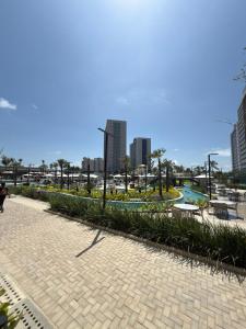 a cobblestone walkway in a city with tall buildings at BEACH RESORT Em SALINAS in Salinópolis