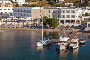 a group of boats docked in a body of water at Patmos Aktis, a Luxury Collection Resort & Spa, Greece in Patmos +124 photos