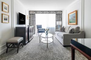 a living room with a couch and a table at Wedgewood Hotel & Spa - Relais & Chateaux in Vancouver +44 photos