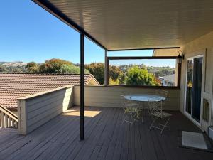 a patio with a table and chairs on a deck at 907 elm in Rodeo