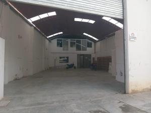 an empty garage with a motorcycle parked in it at Paskary Hotel in Cajamarca