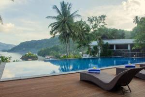 a view of a swimming pool from the deck of a house at Chads Dive Resort Lembeh in Bitung