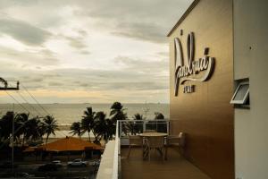 a balcony of a hotel with a view of the ocean at Landruá Flat in São Luís