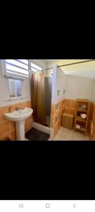 a bathroom with a sink and a shower at Carbet Horizon in Le Carbet +32 photos