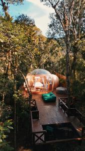 a boat sitting on a deck in the woods at Sora Bubble in Angelina