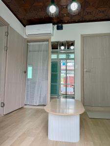 an empty room with a table and a door at 1&2 Stay in Daegu