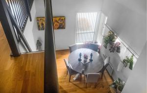 a dining room with a table and chairs at Nice Apartment In Rysstad With Wifi in Rysstad